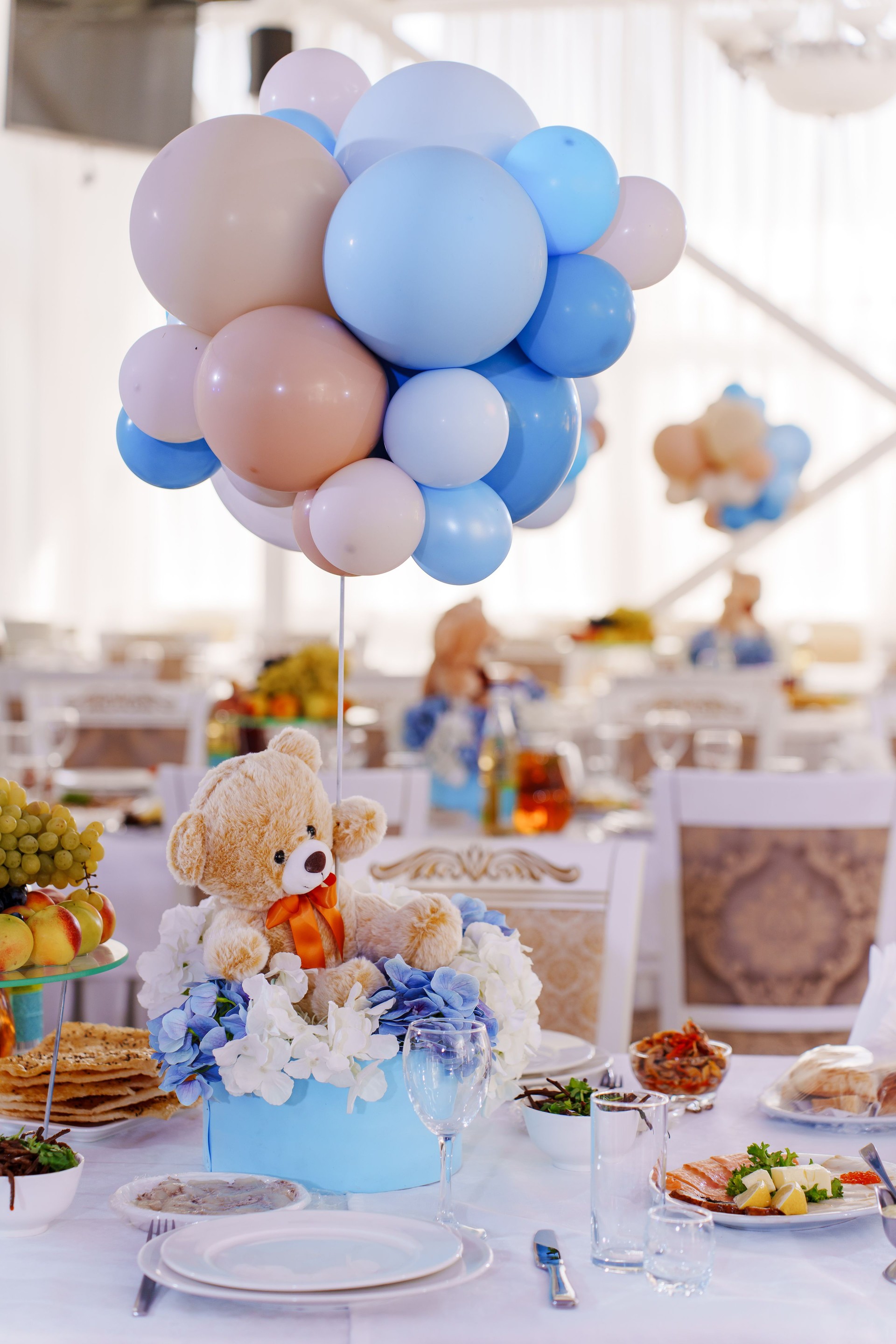 Setting and decorating tables for a children's party in the banquet hall.